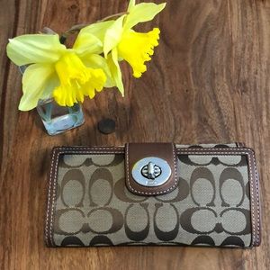 Brown Coach wallet with buckle